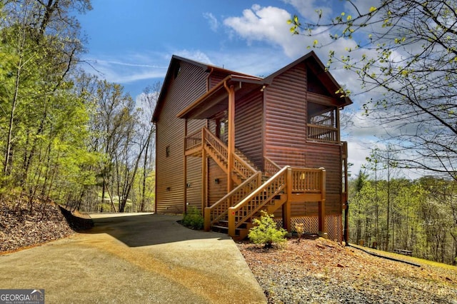 143 Katydid Rd, Morganton, GA 30560 - view of property exterior featuring driveway, stairs, and faux log siding