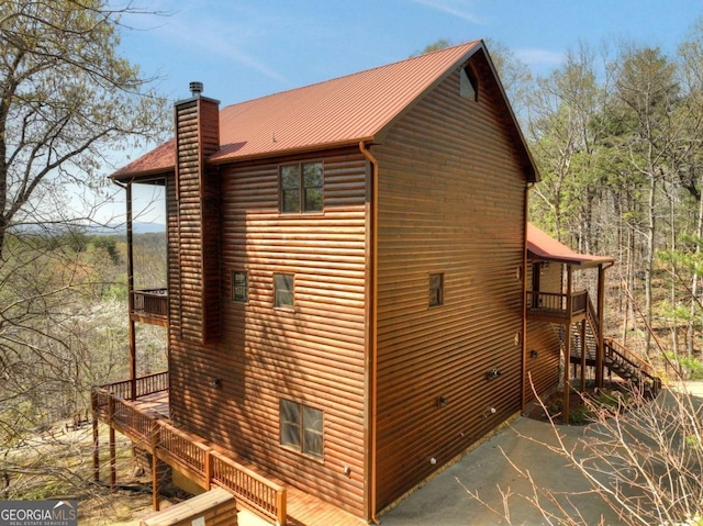143 Katydid Rd, Morganton, GA 30560 - view of home's exterior featuring a wooden deck, stairs, a chimney, and a patio area