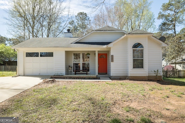 ranch-style home featuring fence, a garage, a chimney, covered porch, and driveway