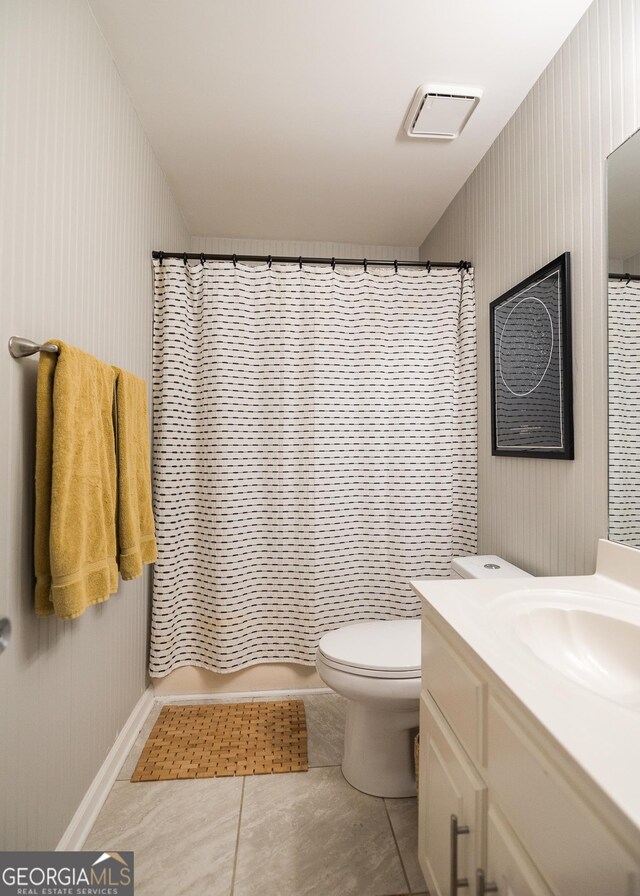 bathroom featuring a shower with curtain, visible vents, tile patterned flooring, vanity, and toilet