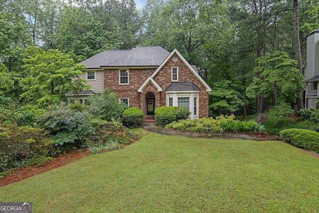 842 Laurel Crest Ct SW, Marietta, GA 30064 - tudor home featuring brick siding, a front yard, and a shingled roof