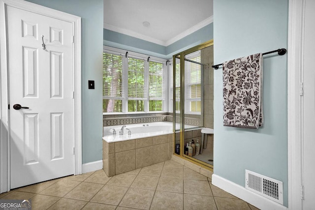 full bath featuring a shower stall, ornamental molding, tile patterned floors, a garden tub, and baseboards