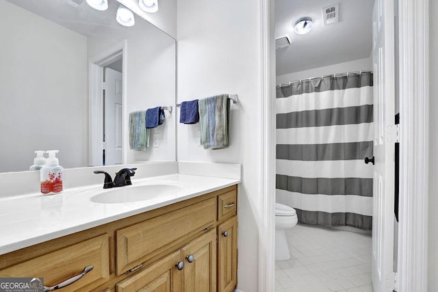 full bathroom with toilet, vanity, and a shower with shower curtain