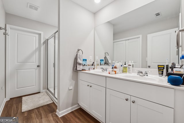4777 Waxwing St, Hoschton, GA 30548 - bathroom featuring visible vents, a sink, and wood finished floors