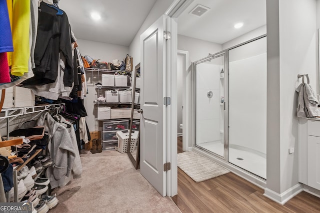 4777 Waxwing St, Hoschton, GA 30548 - spacious closet with visible vents and wood finished floors