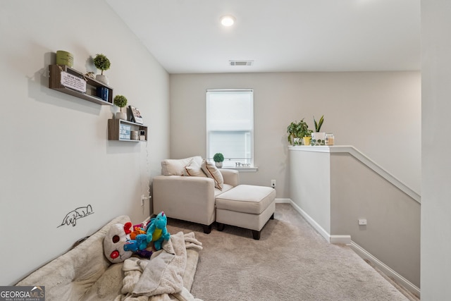4777 Waxwing St, Hoschton, GA 30548 - living area with visible vents, carpet, baseboards, and an upstairs landing
