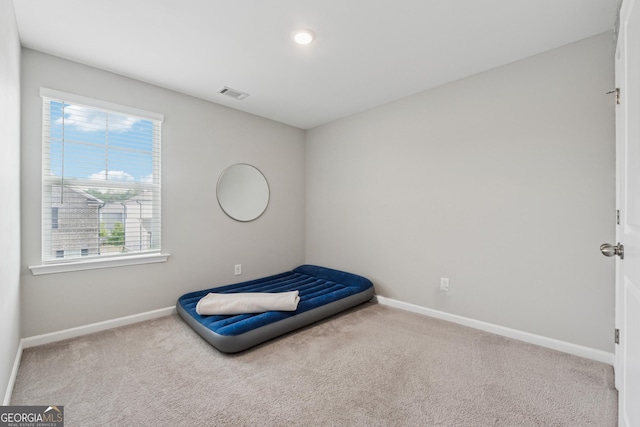 4777 Waxwing St, Hoschton, GA 30548 - unfurnished bedroom featuring baseboards, carpet flooring, and visible vents