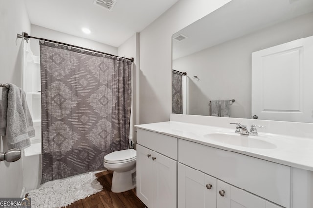 4777 Waxwing St, Hoschton, GA 30548 - bathroom featuring visible vents, vanity, curtained shower, wood finished floors, and toilet