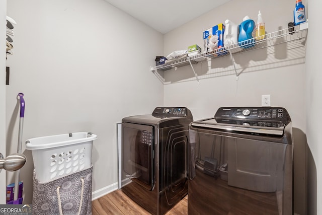 4777 Waxwing St, Hoschton, GA 30548 - washroom featuring baseboards, laundry area, washing machine and dryer, and wood finished floors