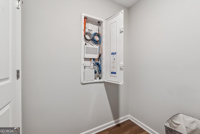 4777 Waxwing St, Hoschton, GA 30548 - laundry area with baseboards and dark wood finished floors