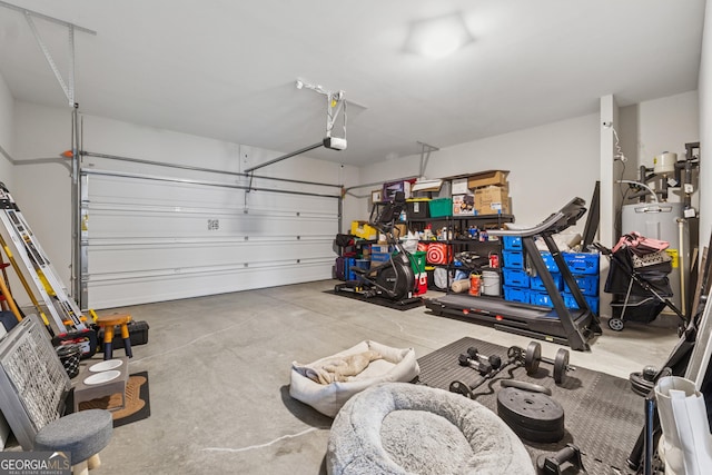 4777 Waxwing St, Hoschton, GA 30548 - garage featuring a garage door opener and gas water heater