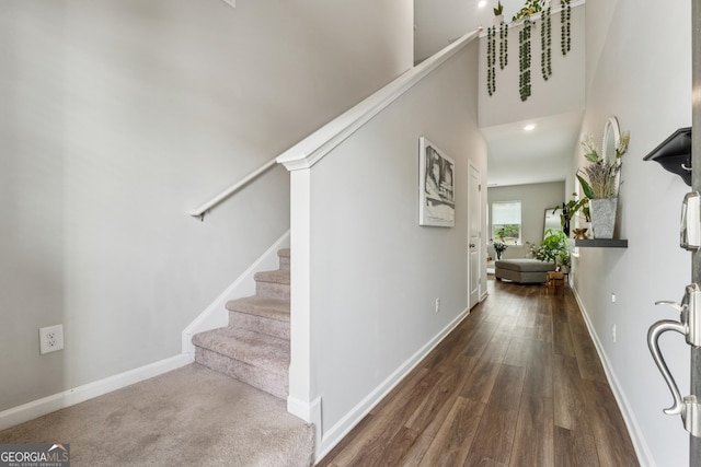 4777 Waxwing St, Hoschton, GA 30548 - hallway featuring baseboards, wood finished floors, and stairway