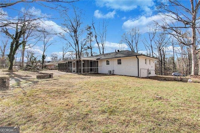 rear view of house with a sunroom