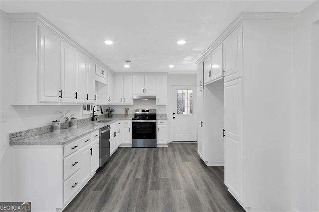 kitchen featuring appliances with stainless steel finishes, under cabinet range hood, recessed lighting, and white cabinetry