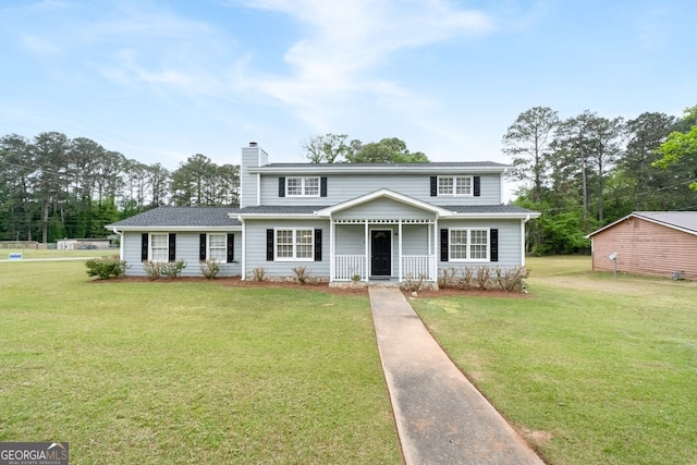 100 Fairview Dr, Stockbridge, GA 30281 - view of front of home with a chimney, covered porch, and a front yard
