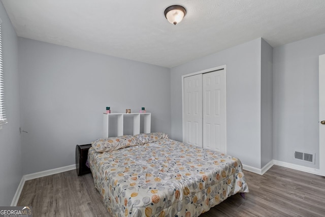 100 Fairview Dr, Stockbridge, GA 30281 - bedroom featuring baseboards, visible vents, and wood finished floors