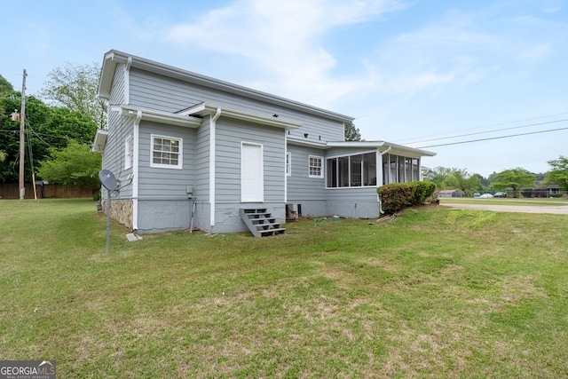 100 Fairview Dr, Stockbridge, GA 30281 - back of house featuring a sunroom and a yard