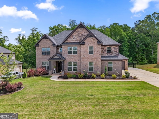 317 Basel Way, Hampton, GA 30228 - craftsman house featuring concrete driveway, brick siding, a front yard, and roof with shingles