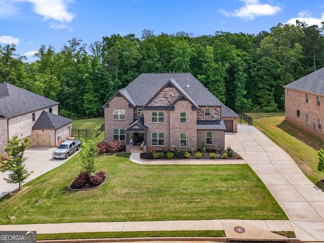 317 Basel Way, Hampton, GA 30228 - craftsman-style house with concrete driveway, brick siding, a garage, and a forest view