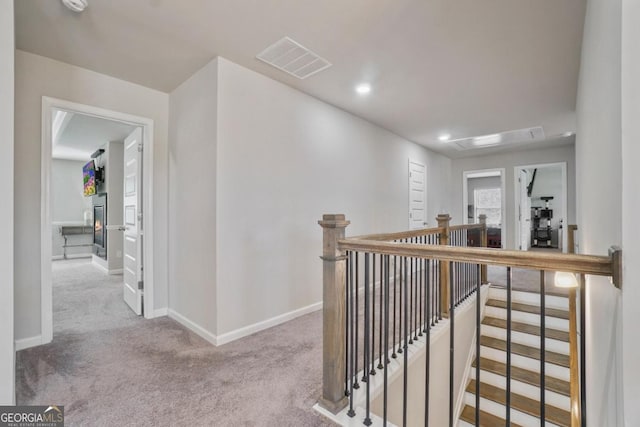 317 Basel Way, Hampton, GA 30228 - corridor with an upstairs landing, carpet, and recessed lighting