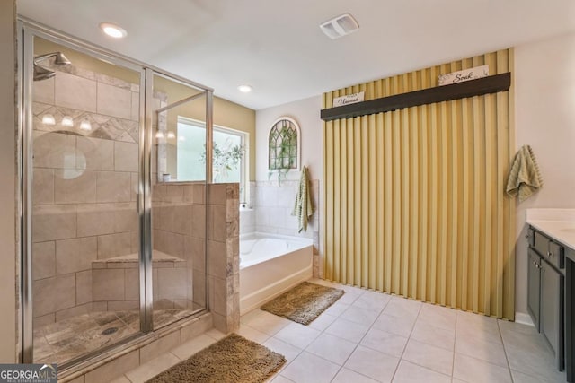 317 Basel Way, Hampton, GA 30228 - full bath with a garden tub, vanity, a stall shower, and tile patterned floors