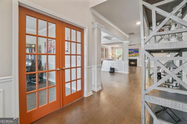 317 Basel Way, Hampton, GA 30228 - hall with french doors, wood finished floors, ornate columns, ornamental molding, and a decorative wall