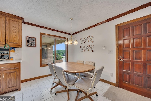 dining area with an inviting chandelier, baseboards, and crown molding