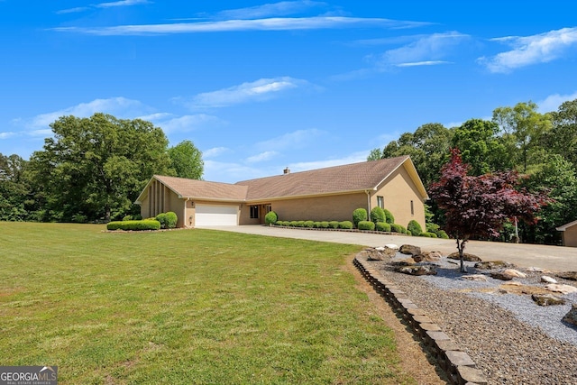 view of home's exterior featuring a garage, stucco siding, a yard, and concrete driveway