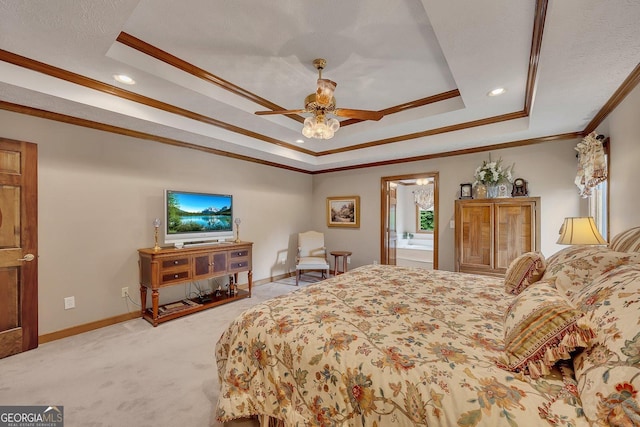 bedroom featuring crown molding, a tray ceiling, light colored carpet, and baseboards