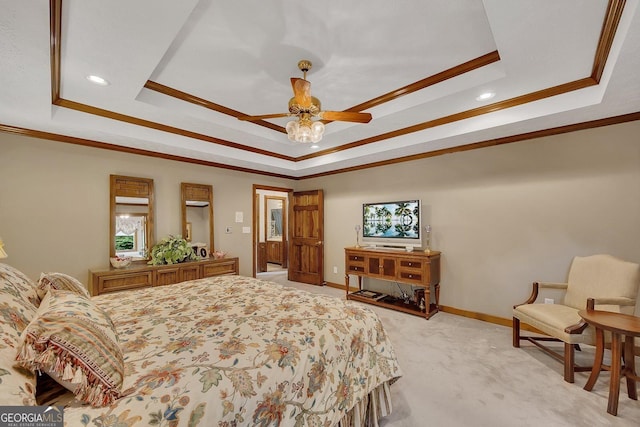 bedroom featuring a raised ceiling, ornamental molding, and baseboards