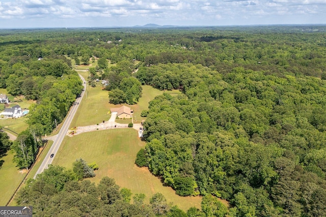 aerial view featuring a forest view
