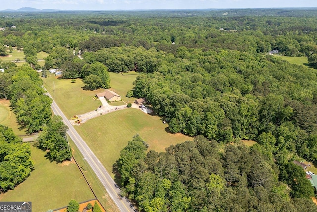 aerial view with a wooded view