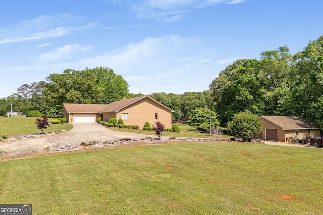 view of front of home with a garage, stucco siding, driveway, and a front yard