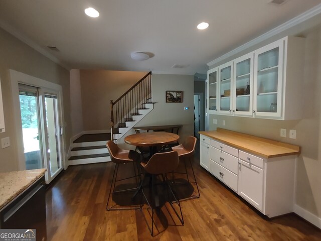 57 Deer Creek Run, Moreland, GA 30259 - dining room with crown molding, stairs, baseboards, dark wood-style floors, and recessed lighting