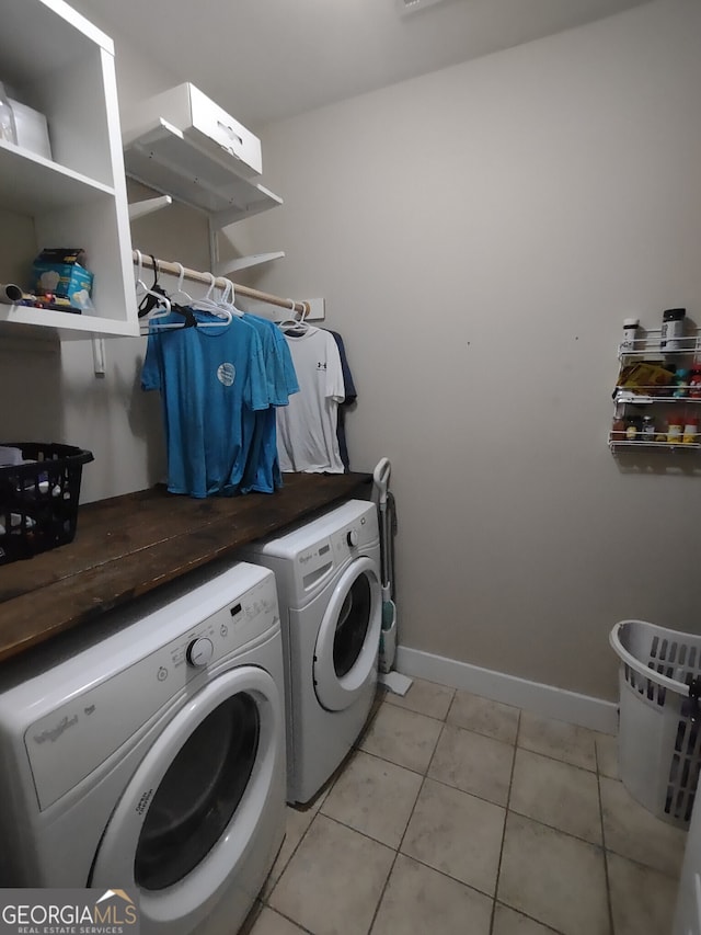 57 Deer Creek Run, Moreland, GA 30259 - laundry area with light tile patterned floors, separate washer and dryer, baseboards, and laundry area