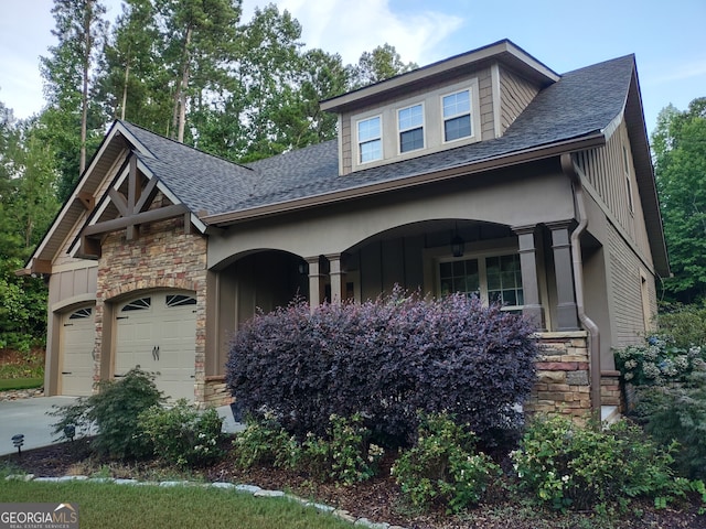 57 Deer Creek Run, Moreland, GA 30259 - craftsman house featuring roof with shingles, covered porch, a garage, and stone siding