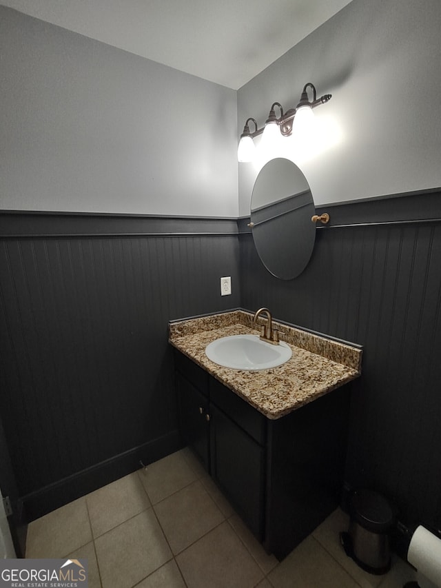 57 Deer Creek Run, Moreland, GA 30259 - bathroom featuring vanity, tile patterned flooring, and a wainscoted wall