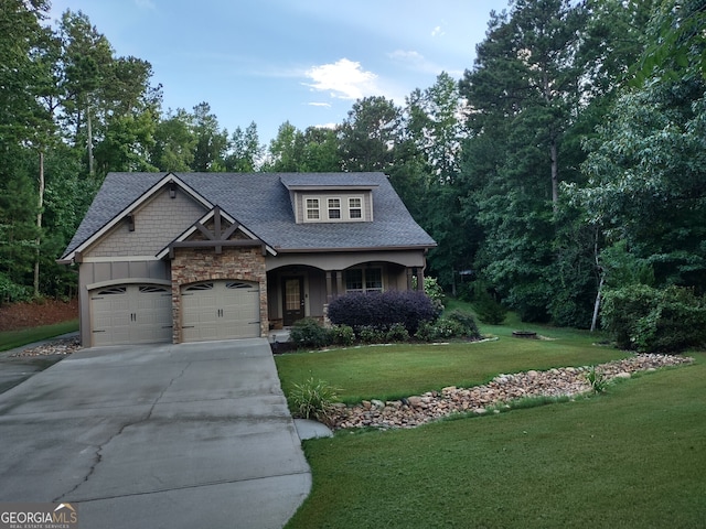 57 Deer Creek Run, Moreland, GA 30259 - craftsman-style home featuring stone siding, a front yard, a shingled roof, concrete driveway, and an attached garage