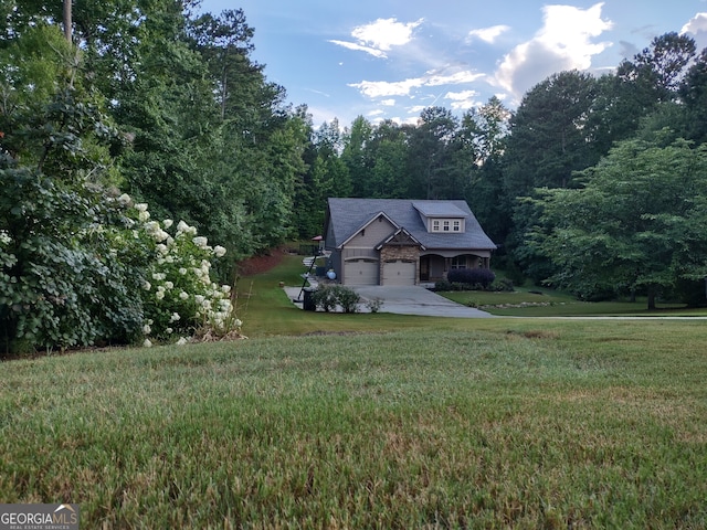 57 Deer Creek Run, Moreland, GA 30259 - view of front of home with concrete driveway, a forest view, and a front yard
