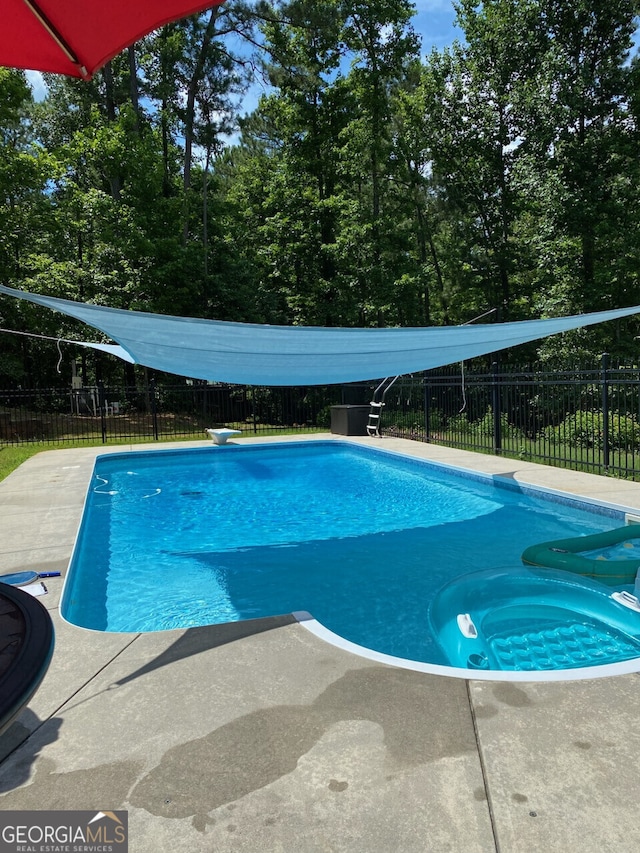 57 Deer Creek Run, Moreland, GA 30259 - view of swimming pool with a fenced in pool, a patio, a diving board, and a fenced backyard