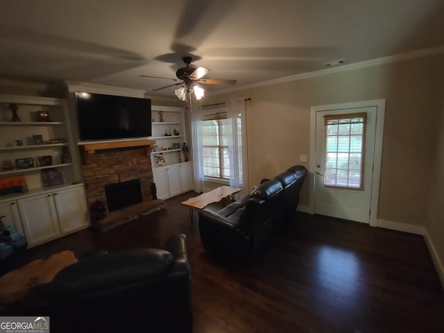 57 Deer Creek Run, Moreland, GA 30259 - living area with crown molding, ceiling fan, a stone fireplace, and dark wood-type flooring