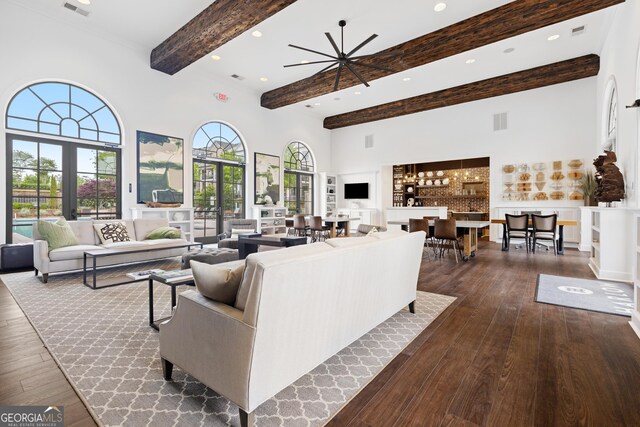 10200 Windalier Way, Roswell, GA 30076 - living area featuring visible vents, dark wood-style flooring, a towering ceiling, and beam ceiling