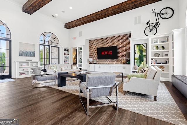 10200 Windalier Way, Roswell, GA 30076 - living area featuring beamed ceiling, plenty of natural light, wood finished floors, and a towering ceiling
