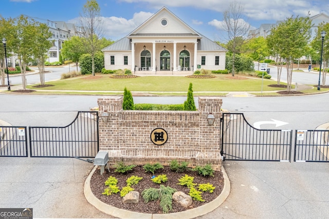 10200 Windalier Way, Roswell, GA 30076 - view of road featuring curbs, a gated entry, a gate, sidewalks, and street lights