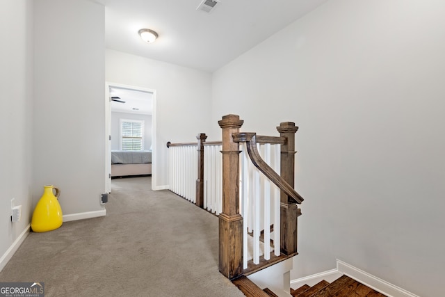 10200 Windalier Way, Roswell, GA 30076 - hallway with baseboards, visible vents, carpet, and an upstairs landing