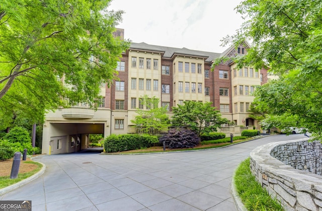 1717 N Decatur Rd NE Unit 214, Atlanta, GA 30307 - view of building exterior with driveway