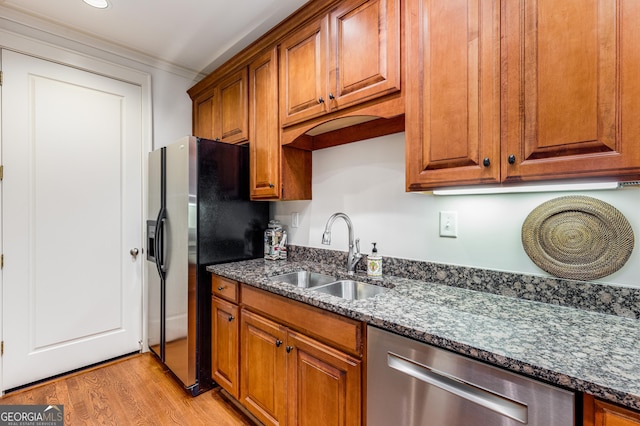 1717 N Decatur Rd NE Unit 214, Atlanta, GA 30307 - kitchen with brown cabinetry, a sink, dishwasher, and fridge with ice dispenser