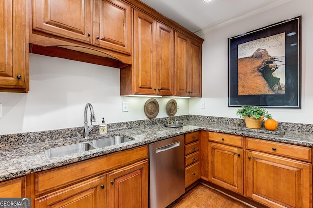 1717 N Decatur Rd NE Unit 214, Atlanta, GA 30307 - kitchen with dark stone countertops, brown cabinetry, a sink, and dishwasher