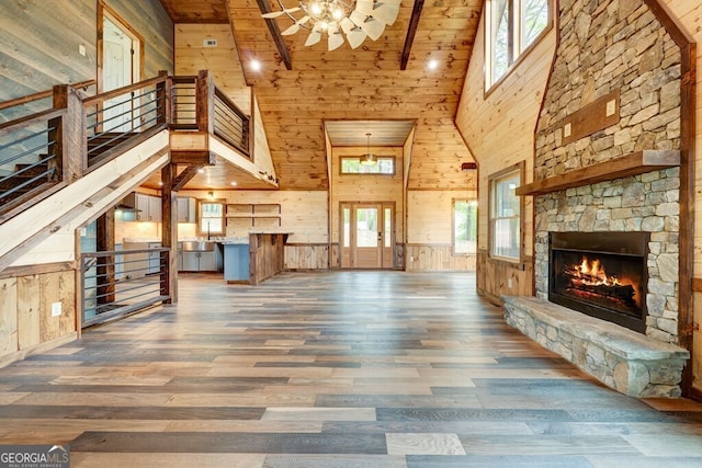 171 Antler Way, Morganton, GA 30560 - unfurnished living room featuring high vaulted ceiling, wooden walls, healthy amount of natural light, wood finished floors, and wood ceiling