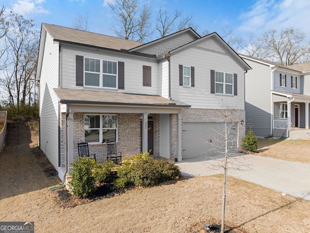 352 Walnut Grove Way, Pendergrass, GA 30567 - view of front facade featuring a porch, a garage, concrete driveway, and brick siding